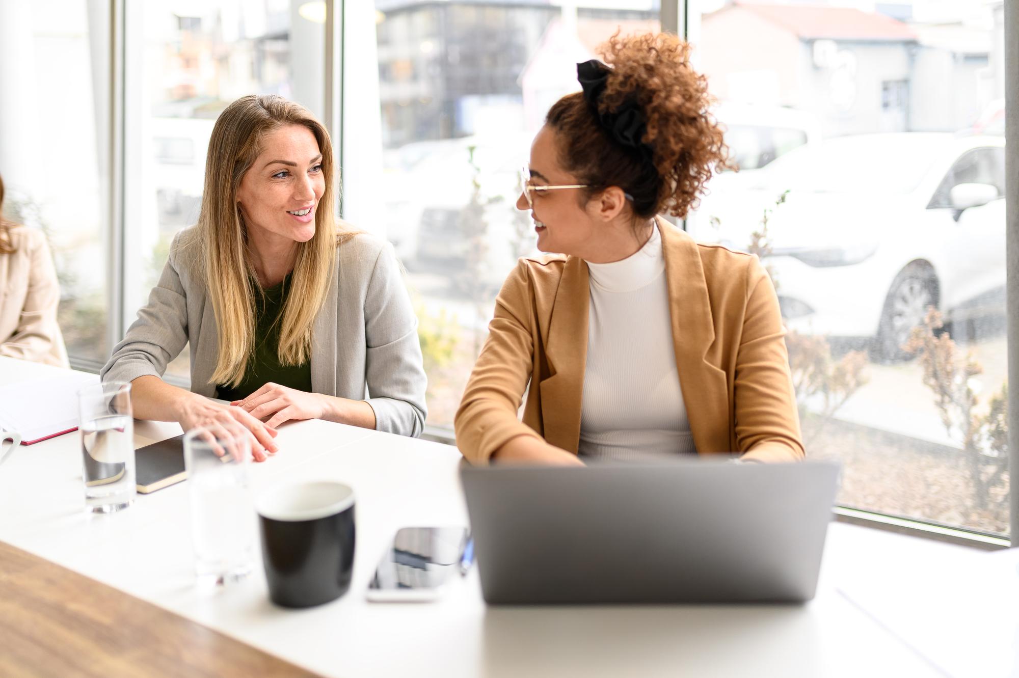 Two professionals in a focused business conversation